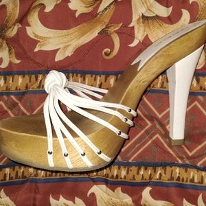 BEBE White strappy high heels.